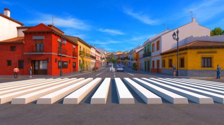 Illustration de l'effet d'optique d'un passage piéton en 3D dans un village espagnol, générée par intelligence artificielle.